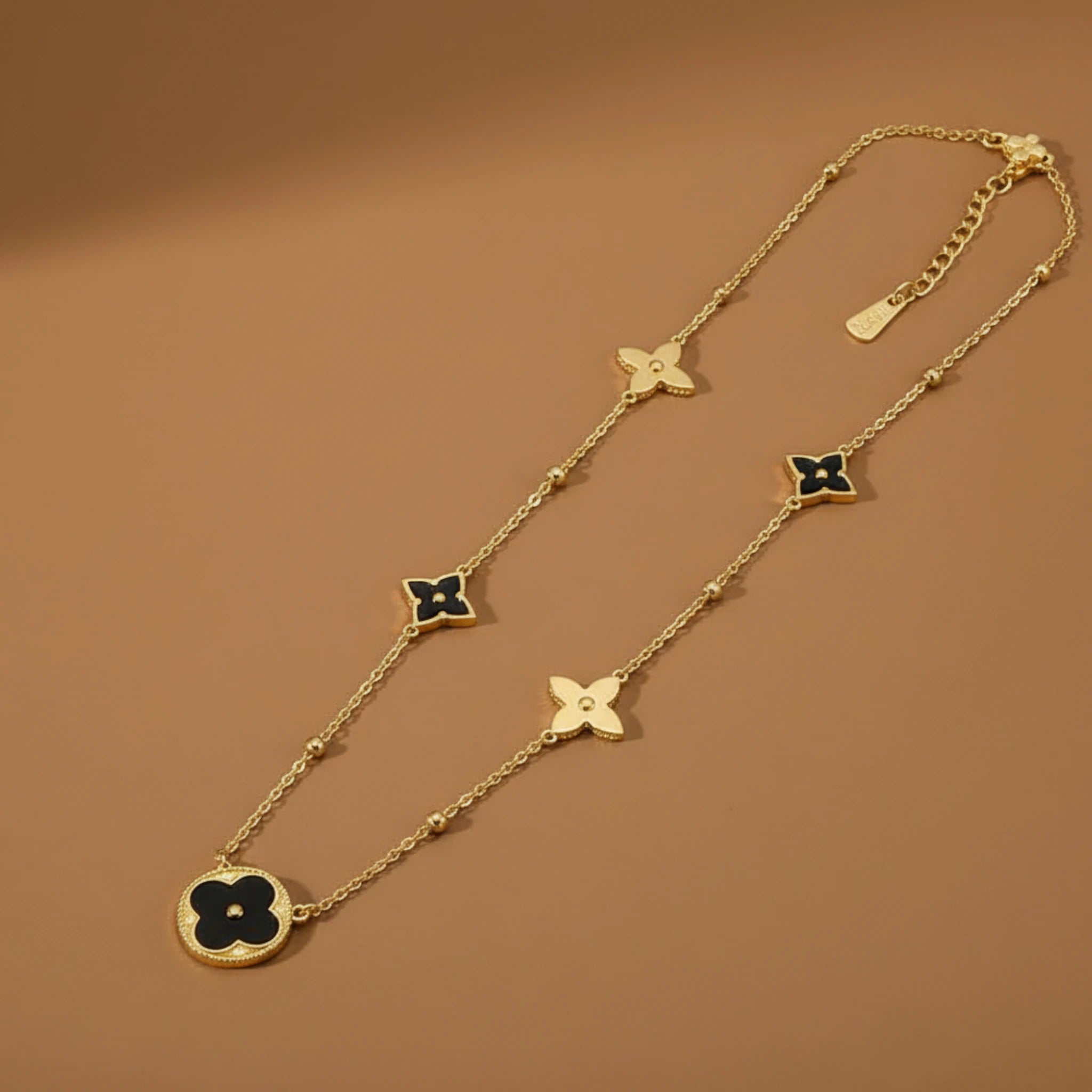 Gold Necklace with Black Clover Pendants
