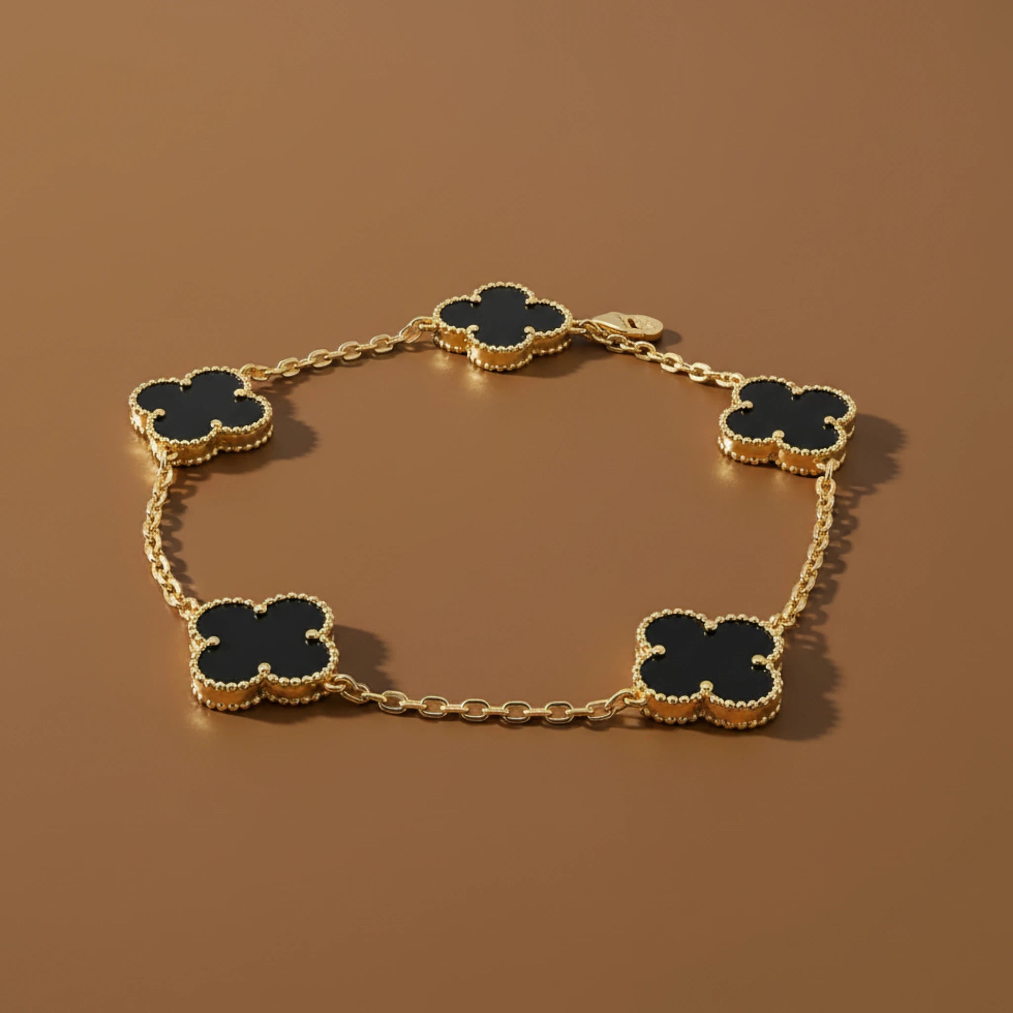 Gold Bracelet with Black Clover Charms