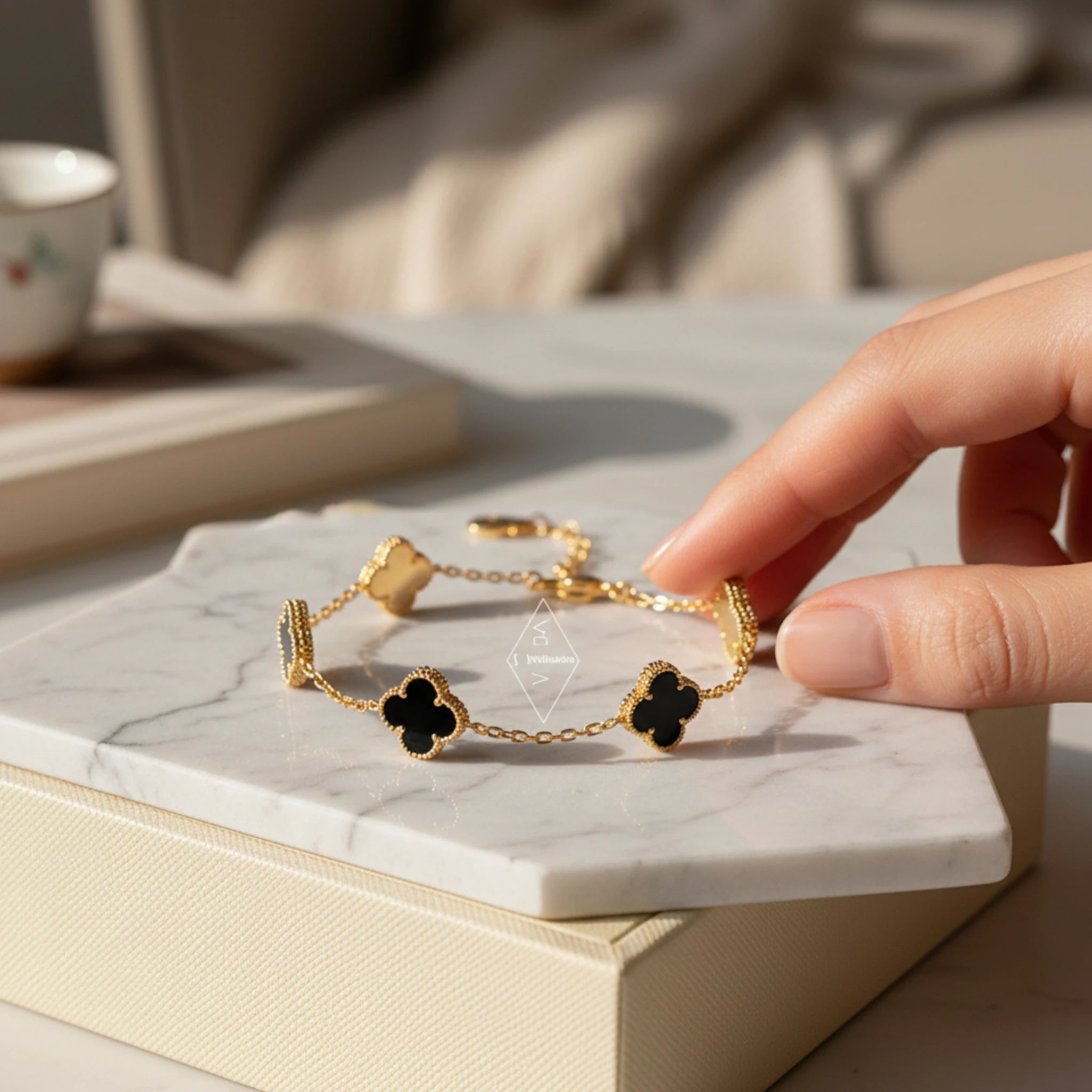 Gold Bracelet with Black Clover Charms
