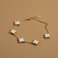Gold Clover Charm Bracelet with White Inlay Accents